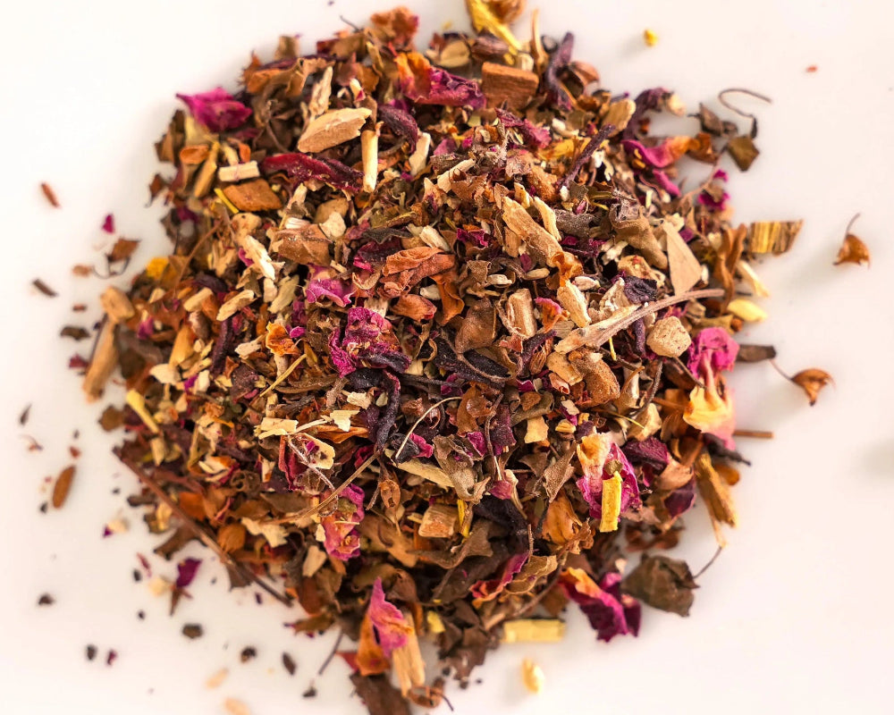 Loose-leaf Seventh Heaven Herbal Tea showing ashwagandha, cinnamon, tulsi, rose petals, licorice root, and hibiscus