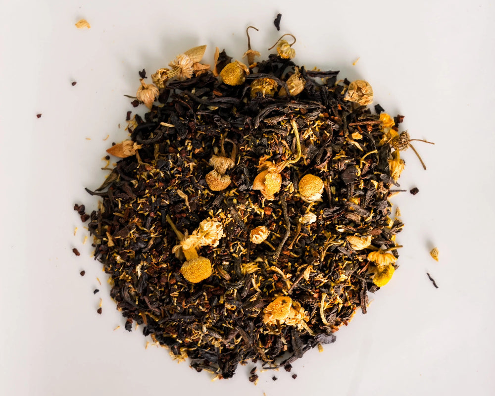 Loose-leaf Calm Focus chamomile black tea blend with black tea, roasted chicory, and chamomile flowers