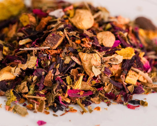 Loose-leaf Dandy Heart antioxidant herbal tea blend with hibiscus, dandelion leaf, hawthorn, ginger, licorice root, and rose petals