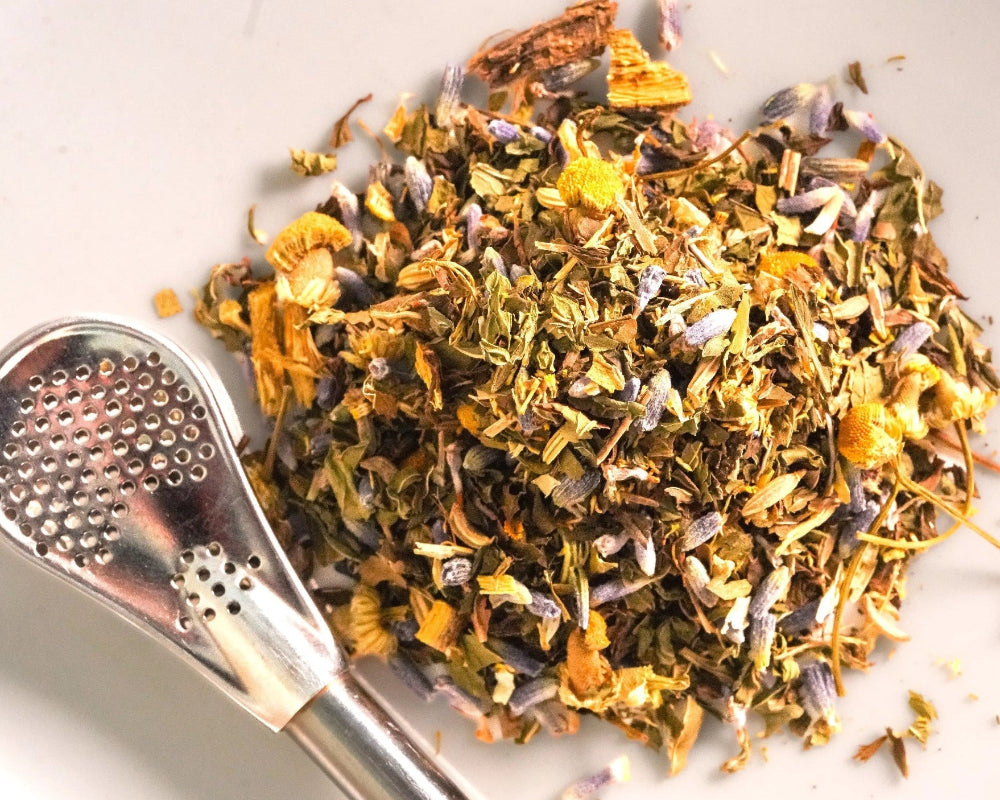 Loose-leaf Mintal Escape digestive tea blend with peppermint, spearmint, fennel, ginger, chamomile, lavender, and licorice root.