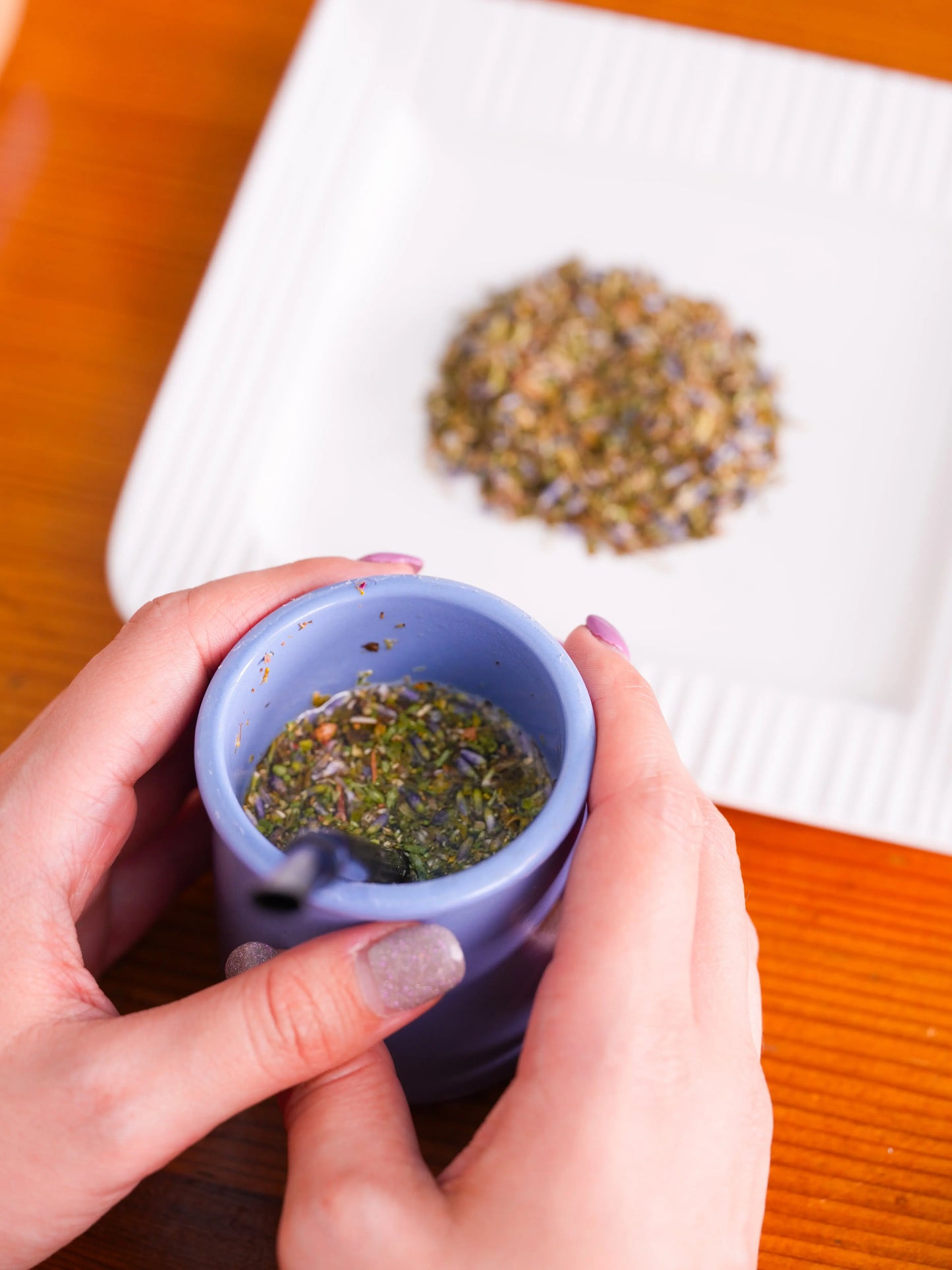 Tea tasting experience setup with cup, bombilla, and loose-leaf tea