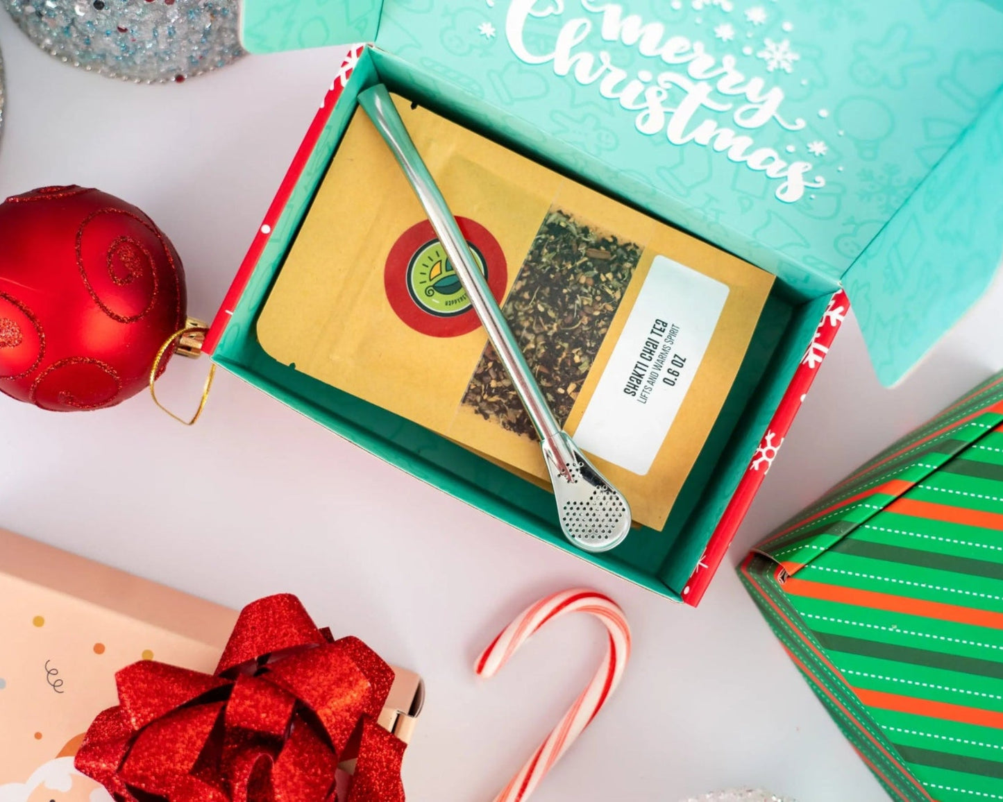 Tea sampler box featuring an assortment of four loose-leaf teas in individual packages.